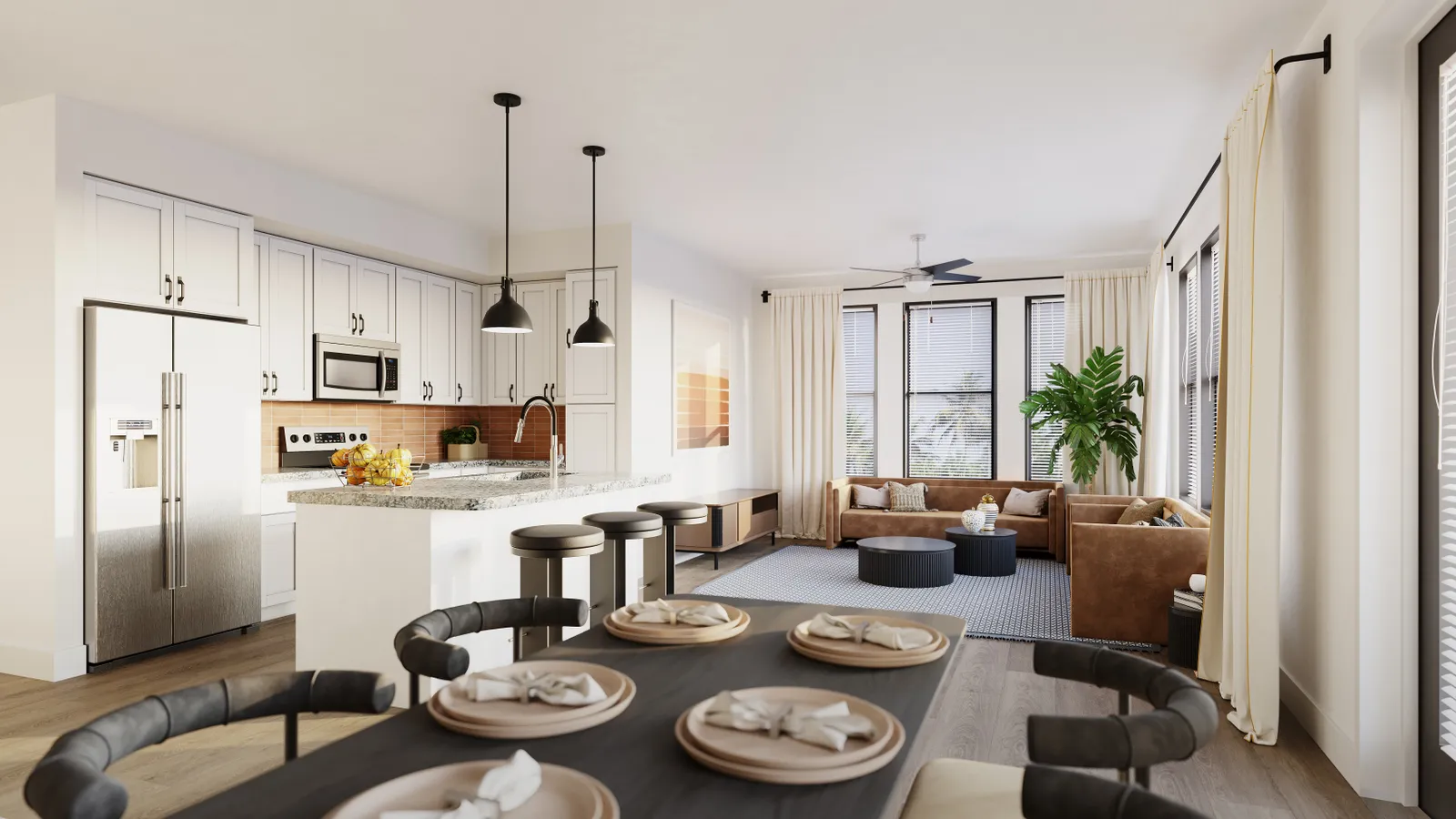 An apartment kitchen area with a set table and island counter.