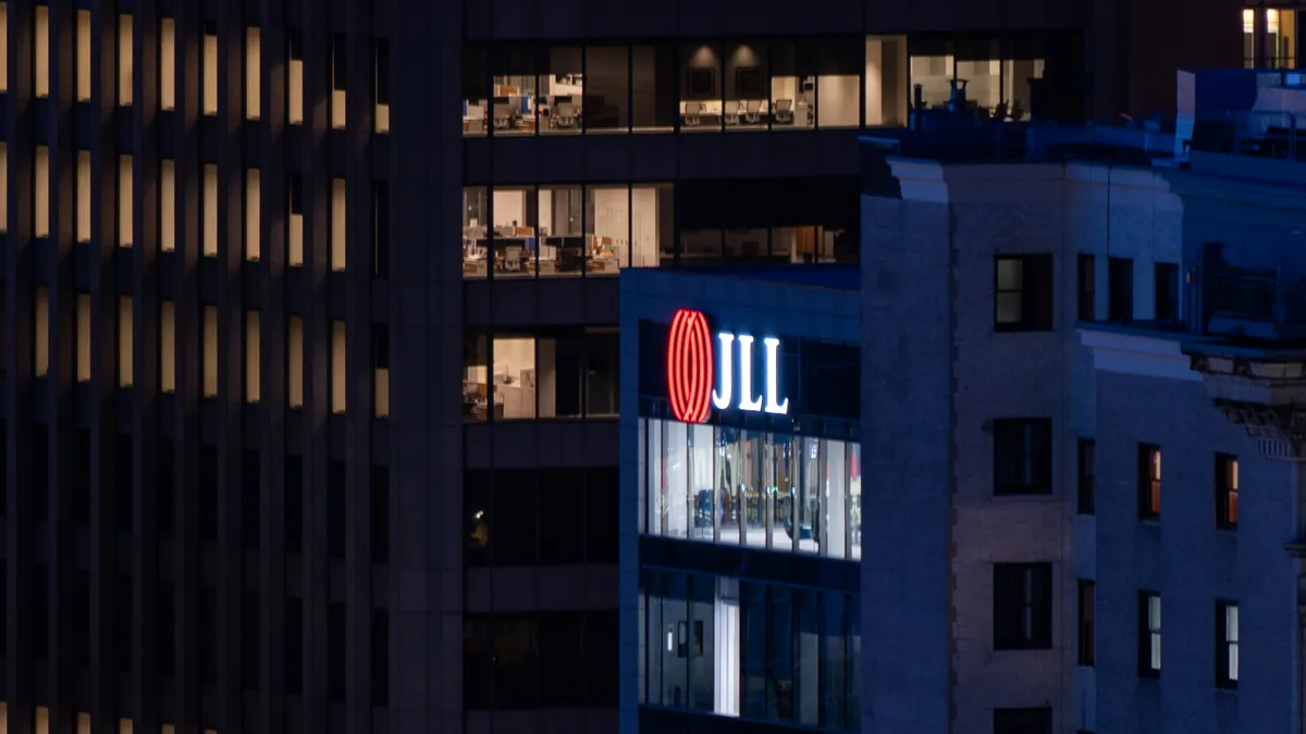 The logo for Jones Lang LaSalle Incorporated (JLL) on a skyscraper in downtown Pittsburgh, Pennsylvania. JLL is a commercial real estate services and property investment firm based in Chicago.