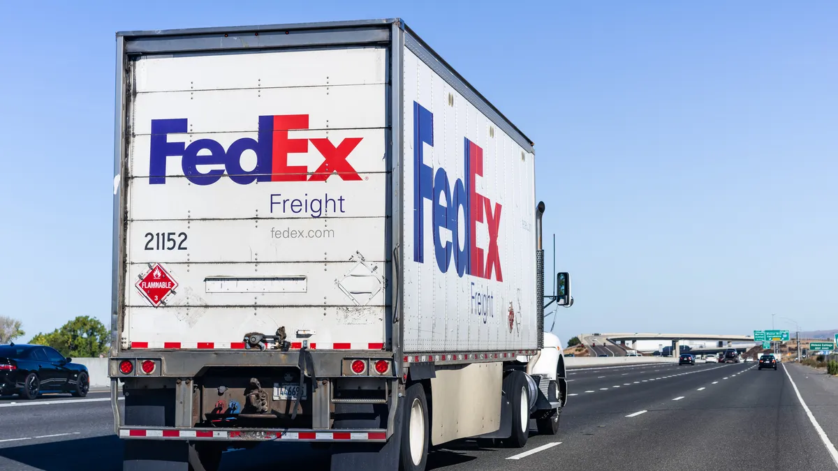 A FedEx Freight tractor-trailer drives on the road. The industry will be closely watching the LTL carrier's spinoff in the next 18 months.