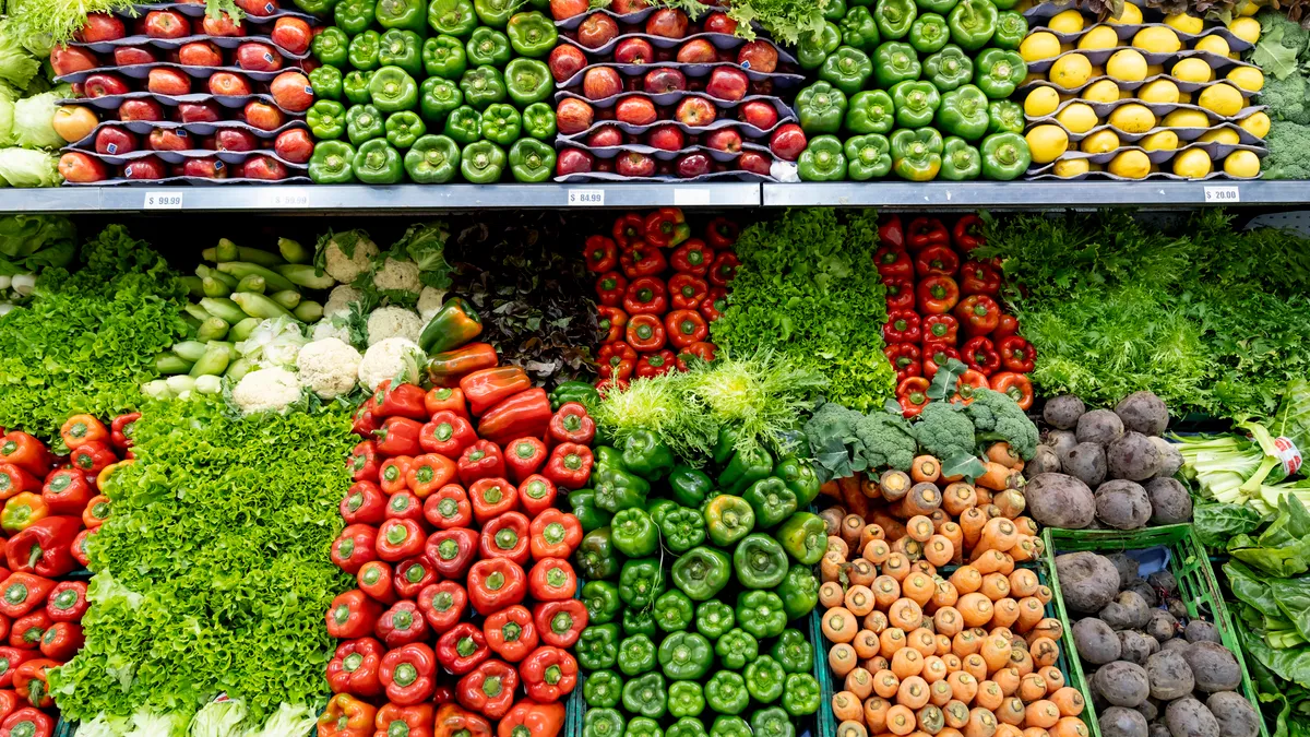 Fresh vegetables and fruits at the refrigerated section of a supermarket.