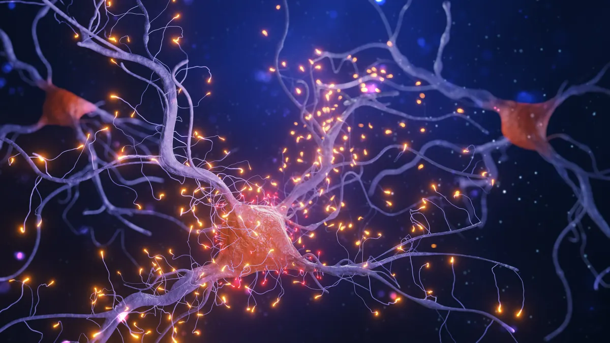 An illustration of nerve cells with light pulses on a dark background.