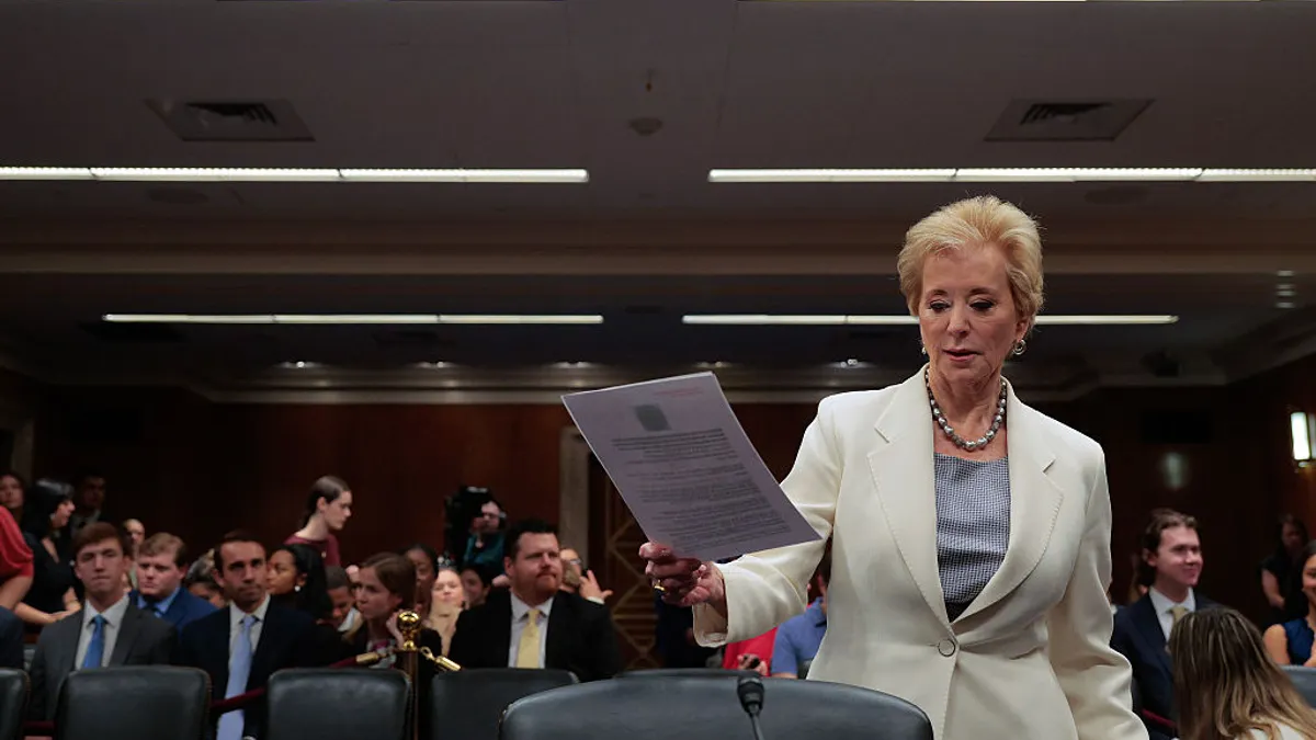 U.S. Department of Education Secretary Linda McMahon stands in front of Senate Appropriations Committee's Labor, Health and Human Services, and Education Subcommittee with papers in her hand