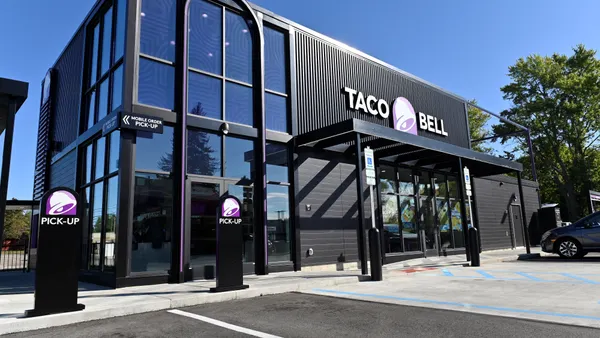 A black and purple restaurant exterior.