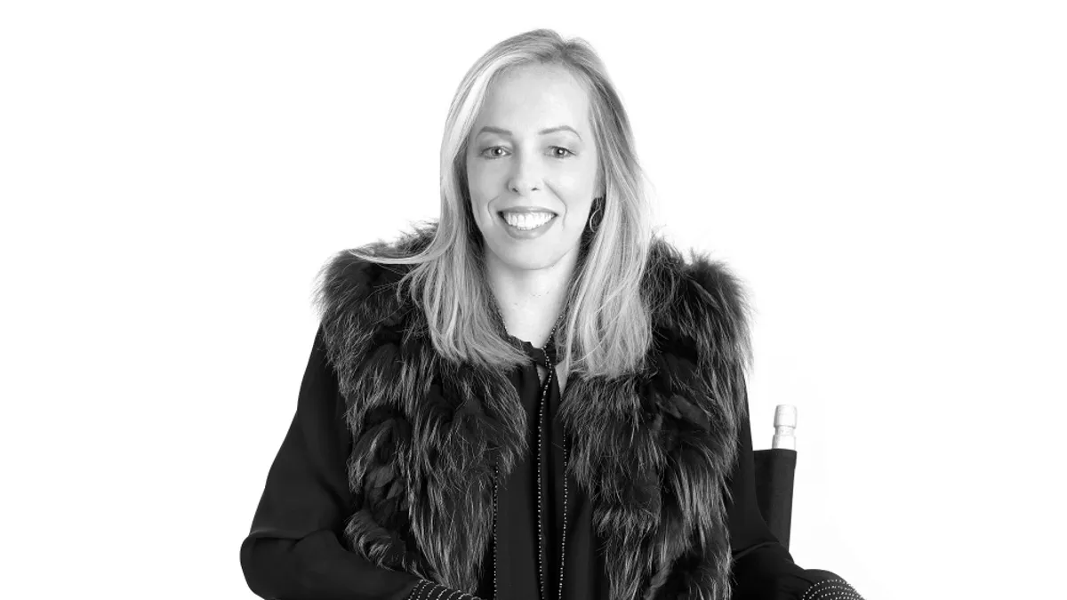 Suzanne Silverstein smiles in a headshot in black and white.