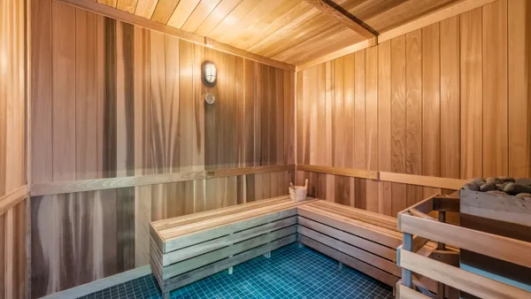 Interior of a wood paneled sauna room.