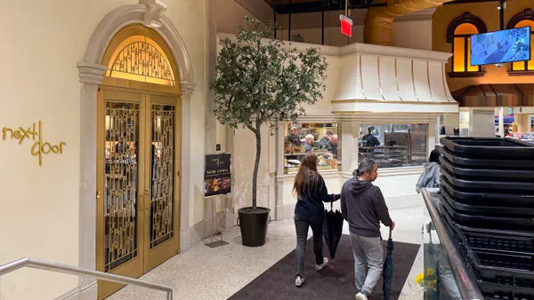 A restaurant entrance inside a grocery store.