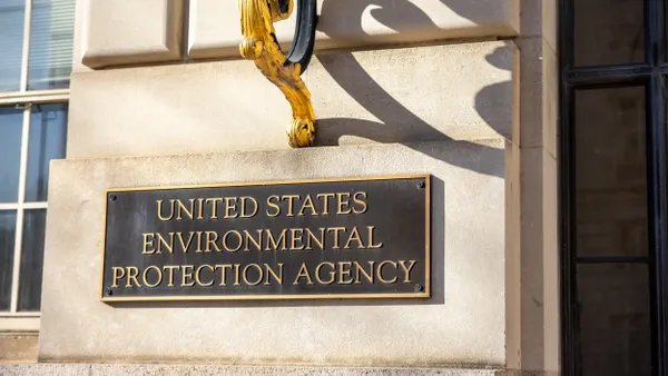 Metal sign that says United States Environmental Protection Agency on stone building