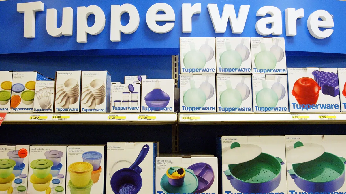 A display of Tupperware products on shelves.