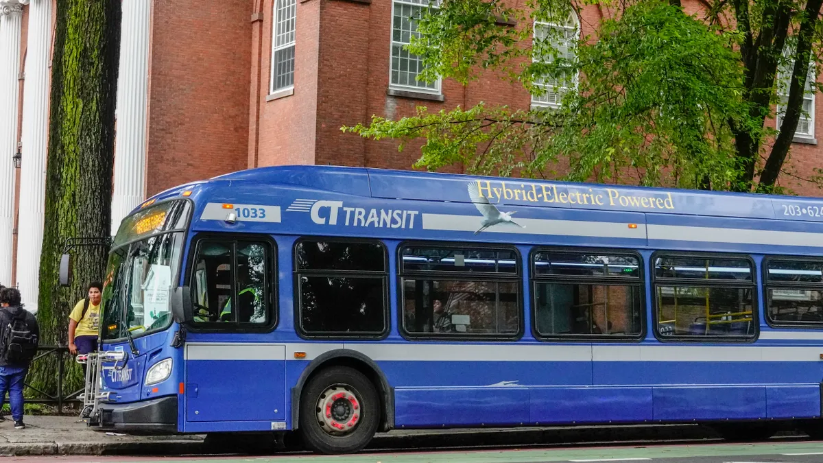 A blue hybrid-electric bus in New Haven, Connecticut.