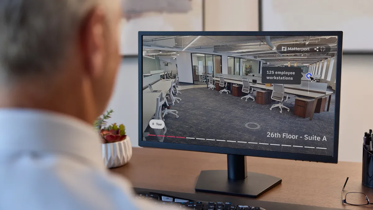 A person looks at commercial real estate visualizations in Matterport.