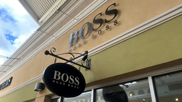 A Boss by Hugo Boss sign hangs above a store