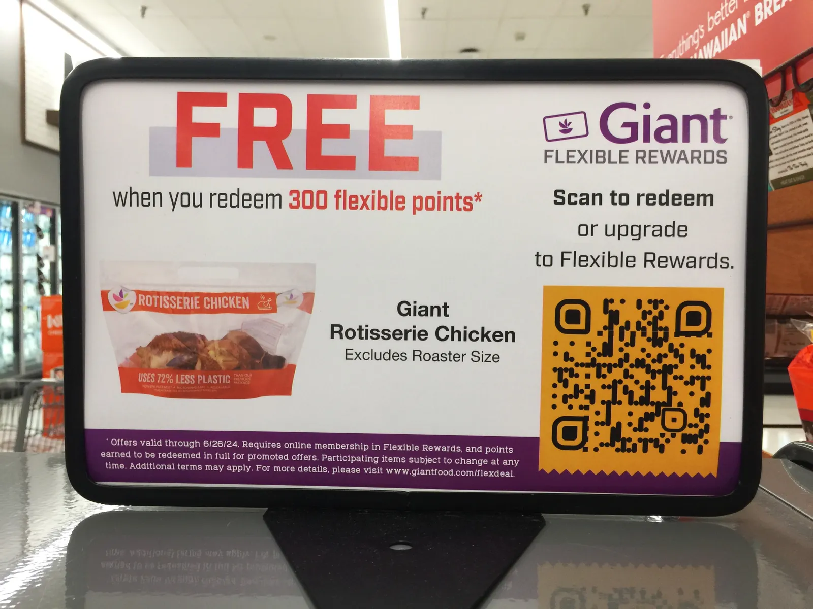 Sign about free rotisserie chicken in a supermarket