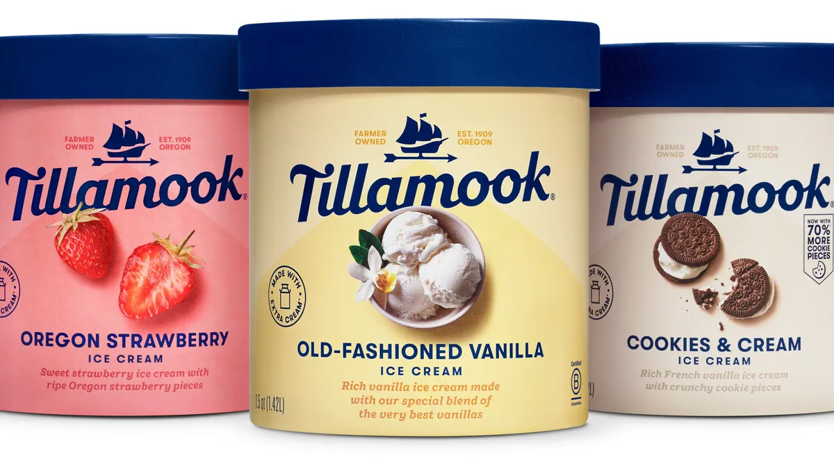 Three Tillamook ice cream gallons in pink/strawberry, beige/vanilla, and a pearl white/cookies and cream, with dark blue font and lids.