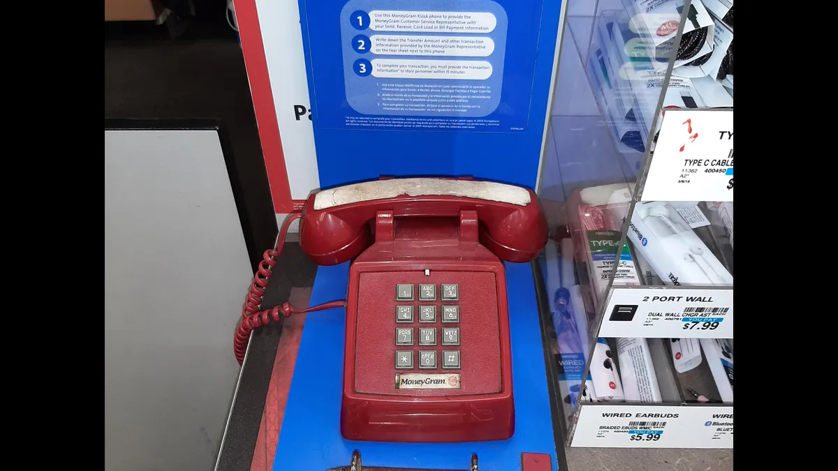 MoneyGram telephone sits on store counter.