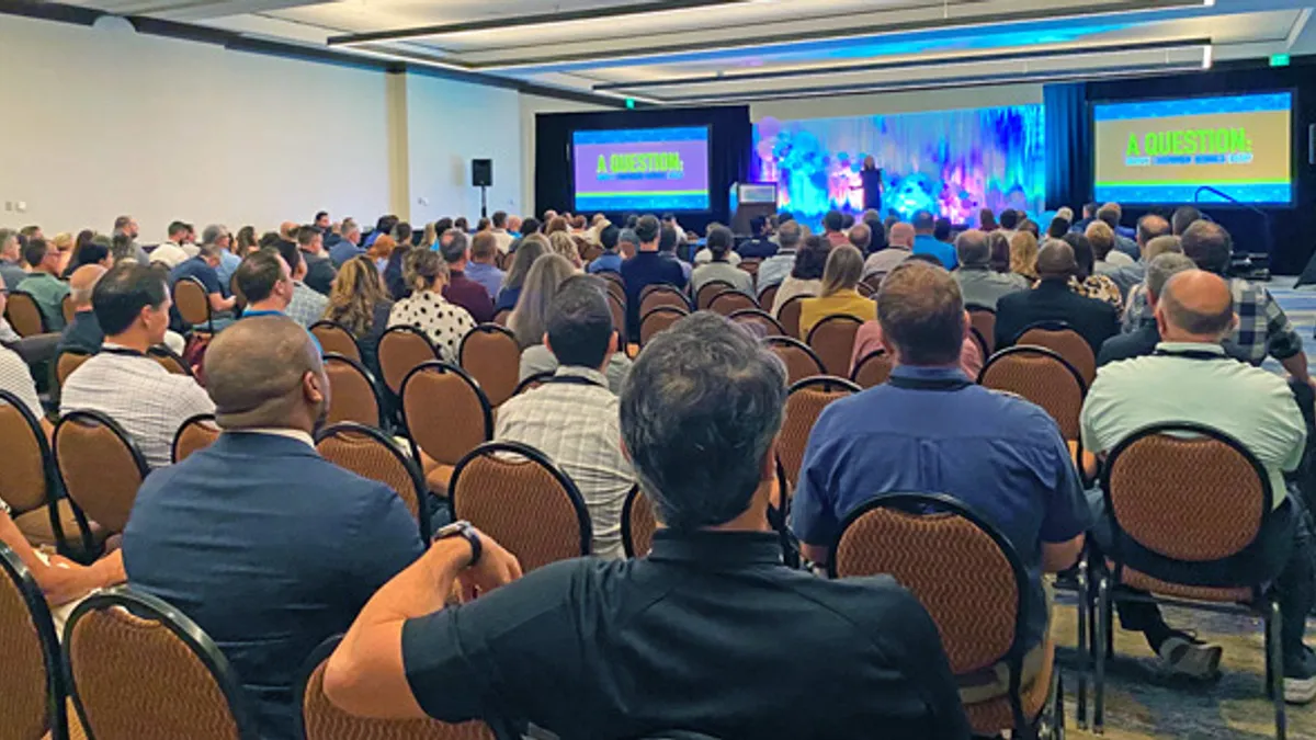 People sitting in conference session