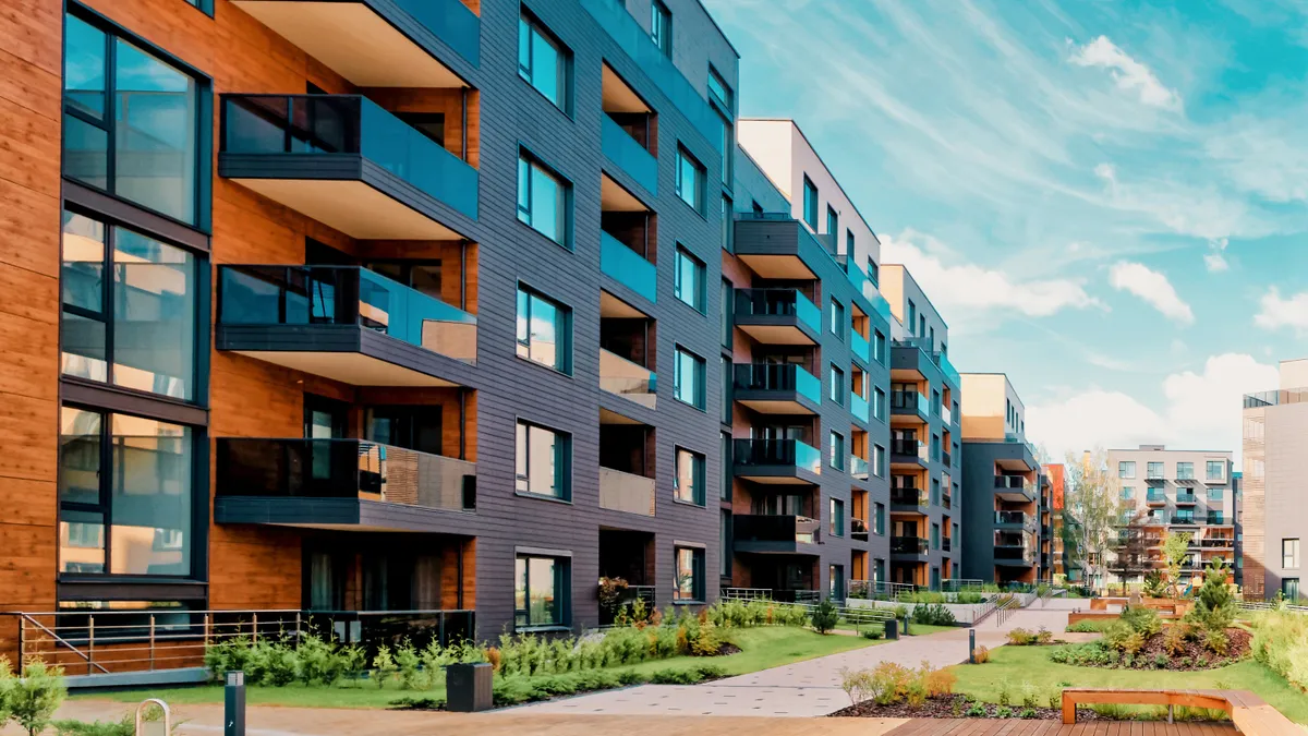 Brown and grey modern complex of residential buildings.