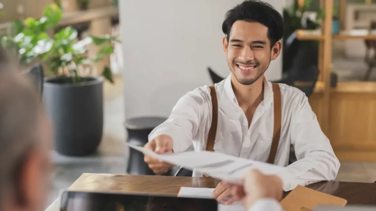 Young man smiling at an interview