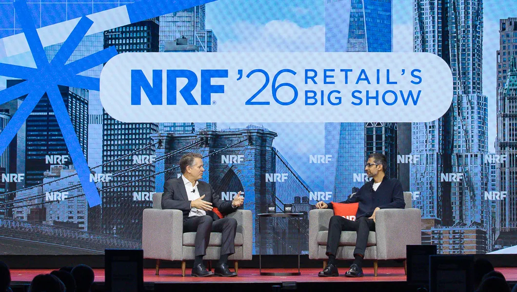 Two executives sitting next to each other at NRF's NYC conference