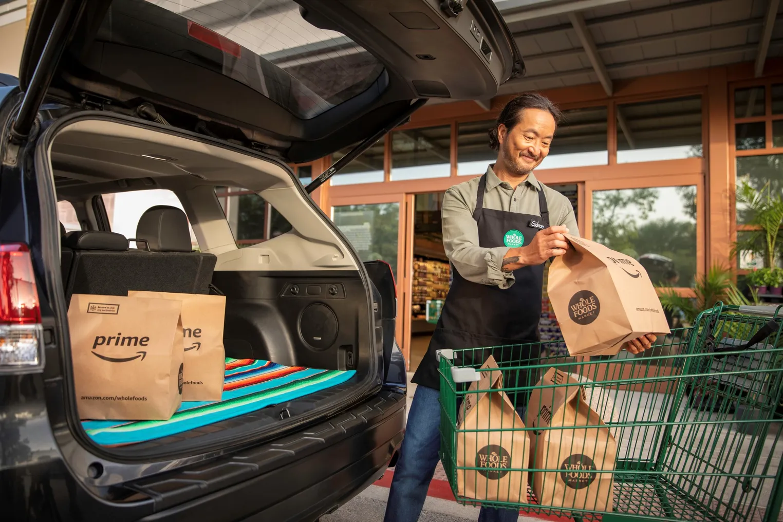 Person moving a paper grocery bag