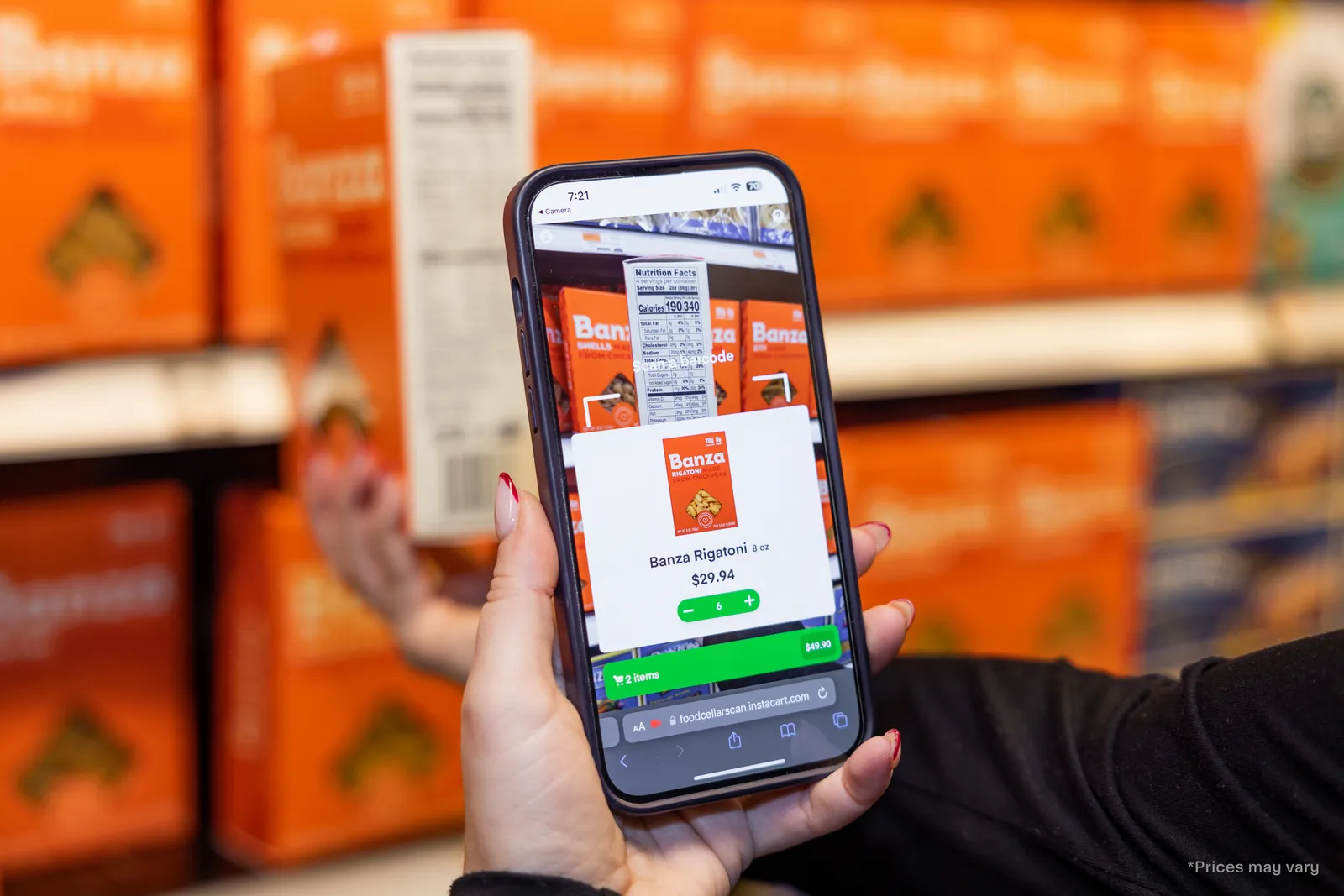 Close-up of someone using a scan and go app to buy a box of rigatoni