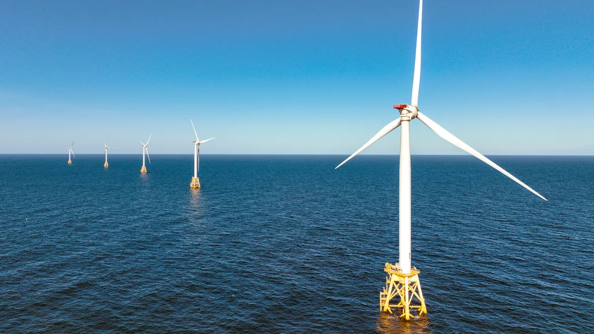 Wind turbines generate electricity on a wind farm.