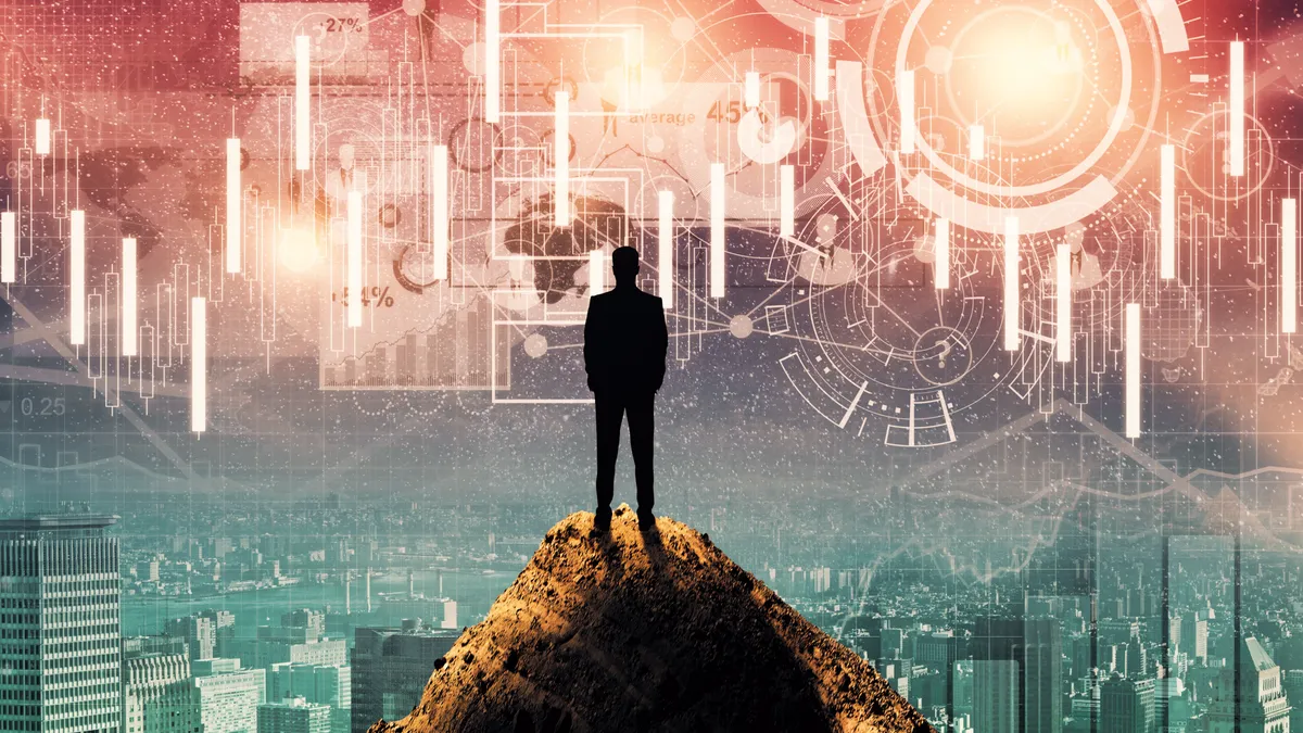 Media concept. Back view of young businessman on mountain top looking at digital business hologram in space and city.