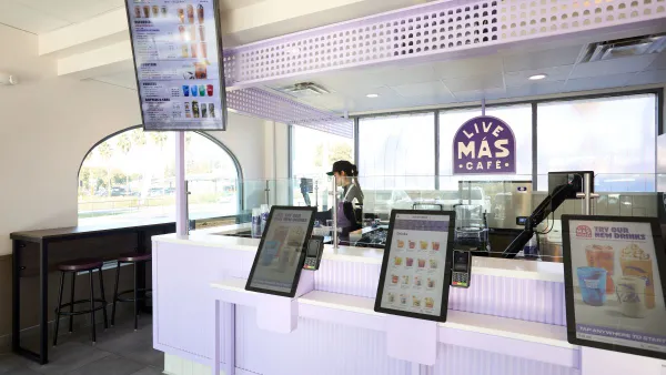 A close up look at a digital beverage menu and kiosks at Taco Bell's Live Mas Cafe