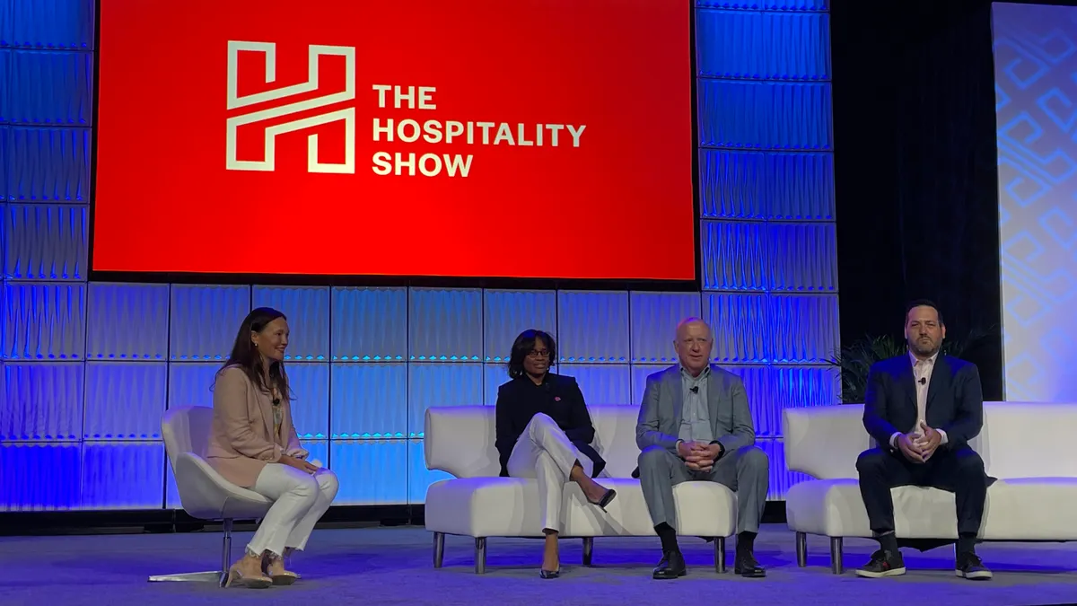 Hospitality leaders speak on a panel at The Hospitality Show in Las Vegas.