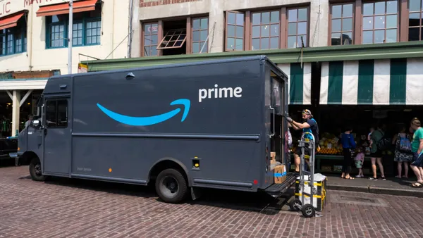 A driver unloads Amazon packages at Pike Place Market in Seattle.
