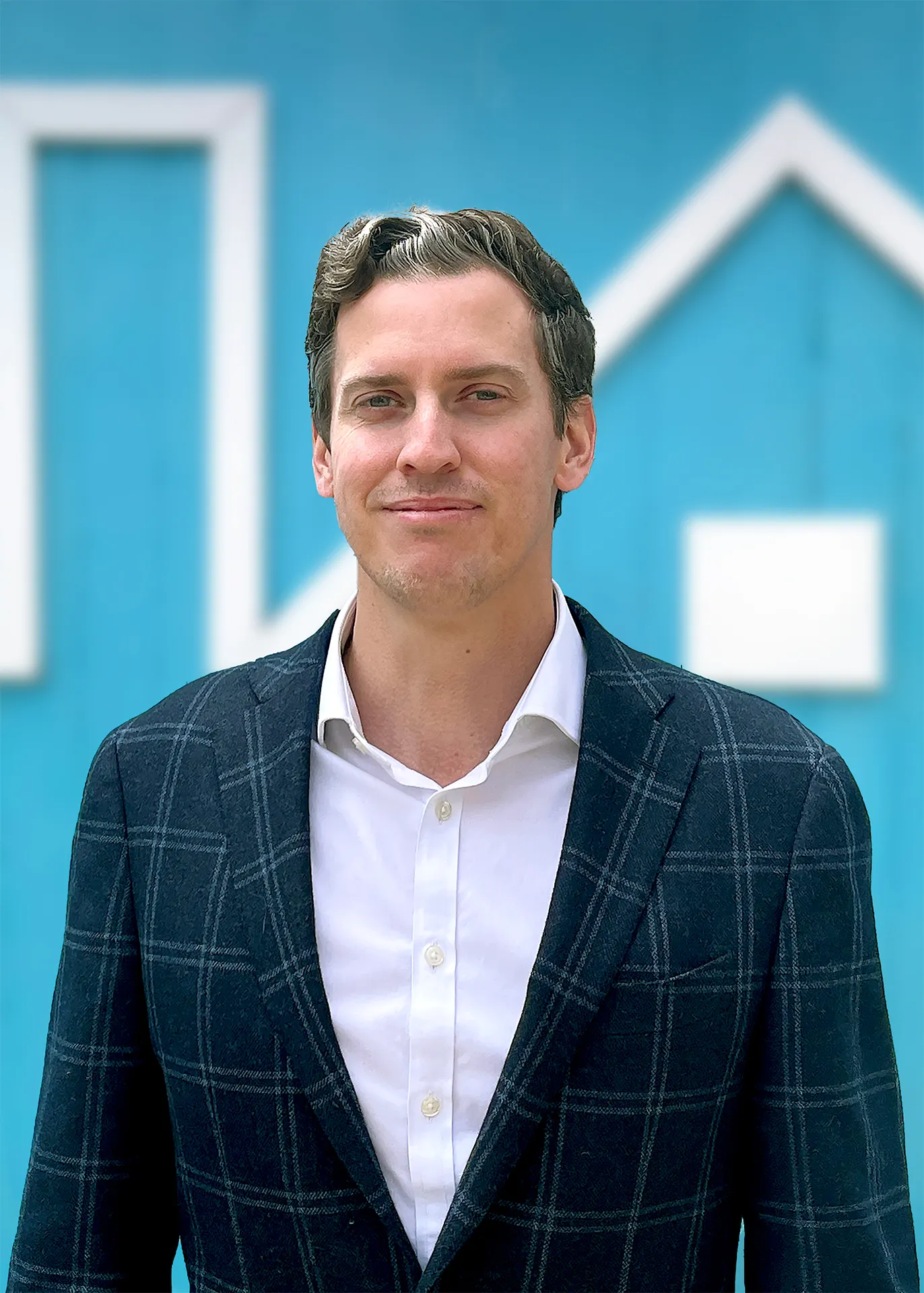 A professional headshot of Scott Caliguire.