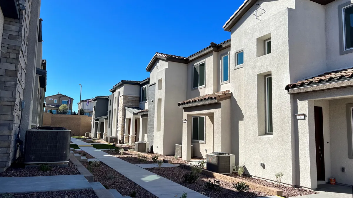 White townhomes beside a street