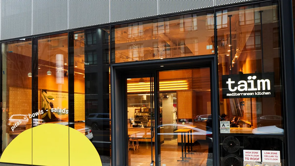 An exterior photo of a Taim restaurant.