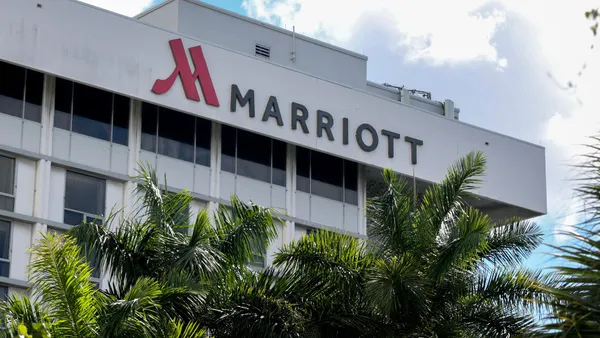 a gray building with signage that reads Marriott