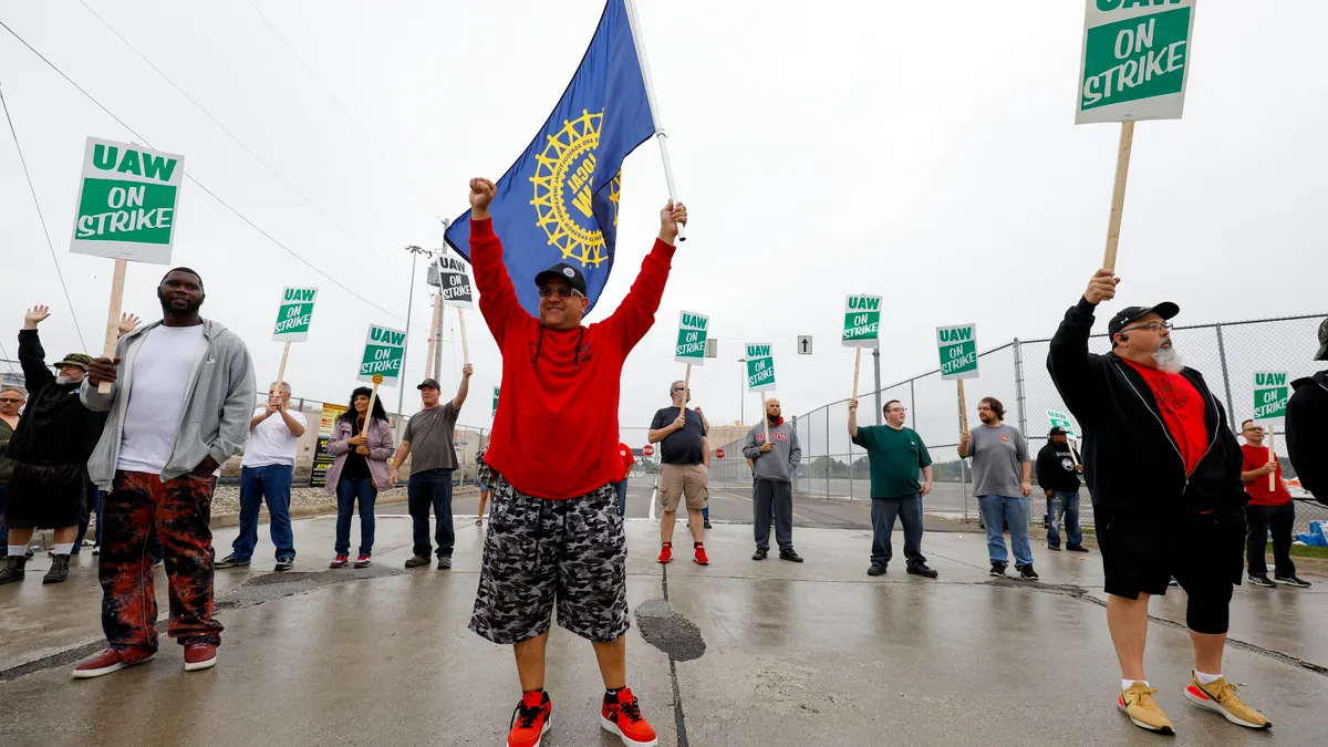 UAW works on strike outside a General Motors factory.