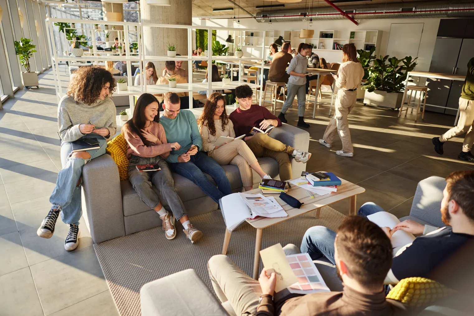 College students gather in a lounge space.