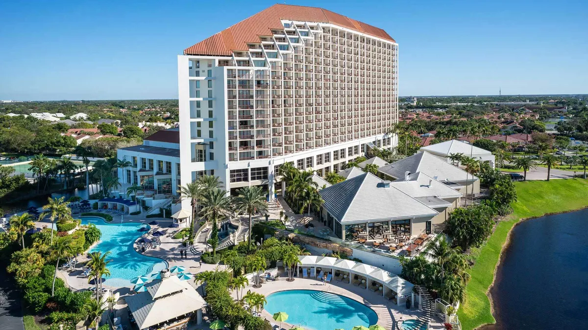 The exterior of the Naples Grande on a sunny day.