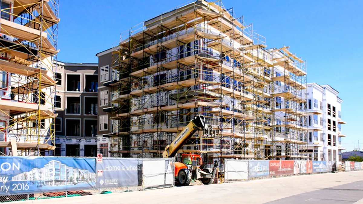 Scaffolding around apartment construction site