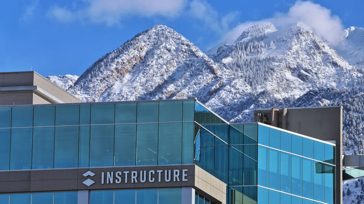 The Instructure headquarters is pictured in front of snow-capped mountains.