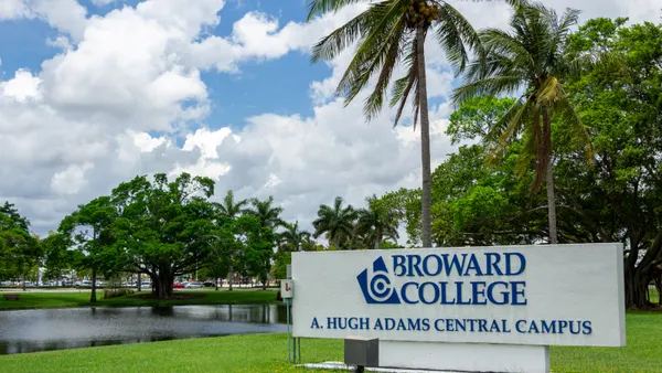 A sign on Broward College's campus depicting its name.