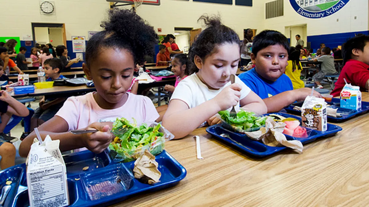 School lunch staff and students enjoy the new school lunch menu created to meet the new standards at the Yorkshire Elementary School in Manassas, VA on Friday, Sept. 7, 2012.