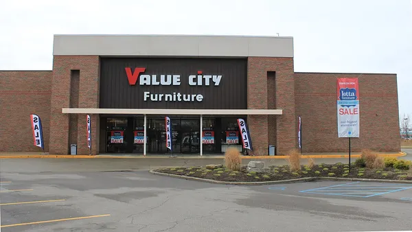 A Value City Furniture exterior storefront and parking lot