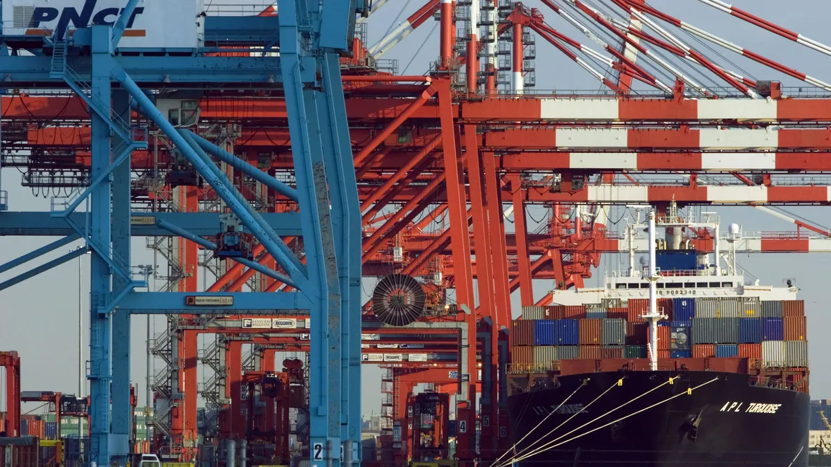 Shipping containers lie stacked on a ship docked at the Port Newark Container Terminal.