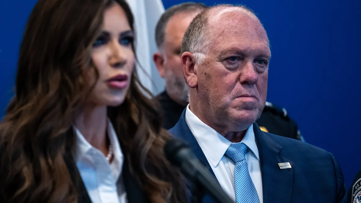 Kristi Noem and Tom Homan