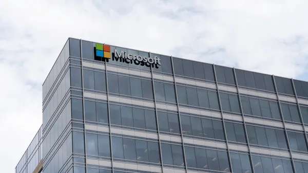 A large glass building with the Microsoft logo visible.