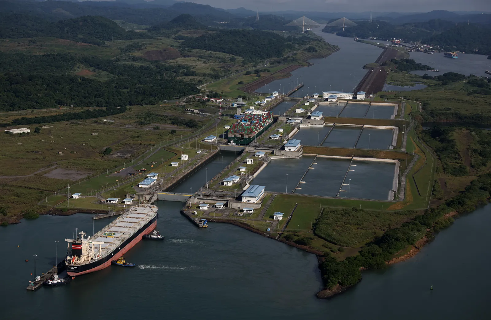 Ship moving through restricted locks in Panama Canal.