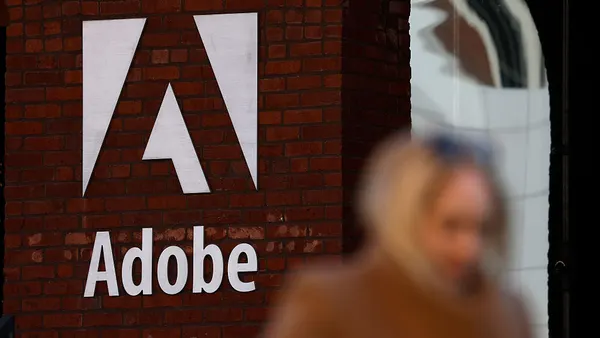 a shot of adobe headquarters with a passerby out of focus in the foreground