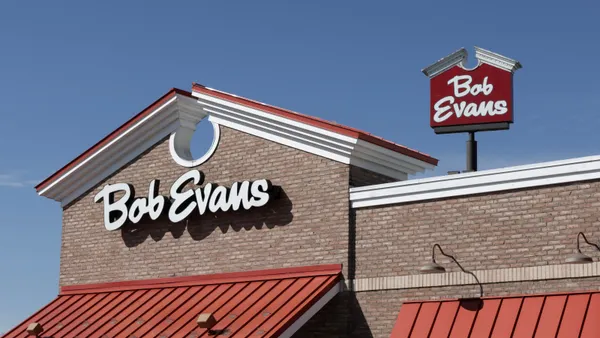 A photogrph of a bricked building with a white sign that says Bob Evans.