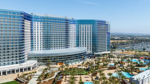 A shot of the Gaylord Pacific's exterior, flanked by a pool complex.
