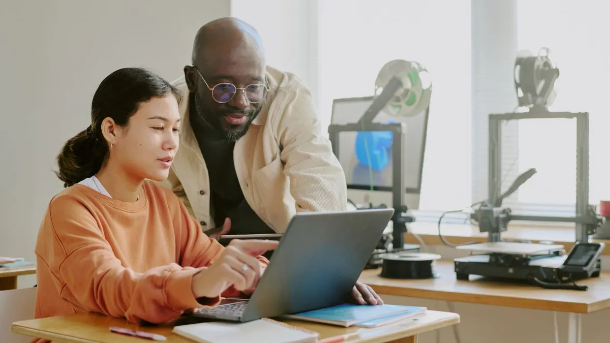 People collaborating on laptop