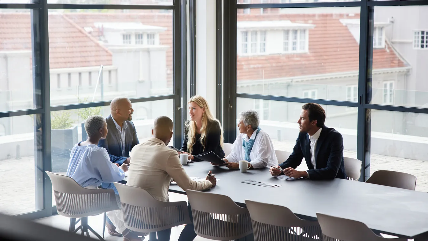 a group of executives inside a conference room